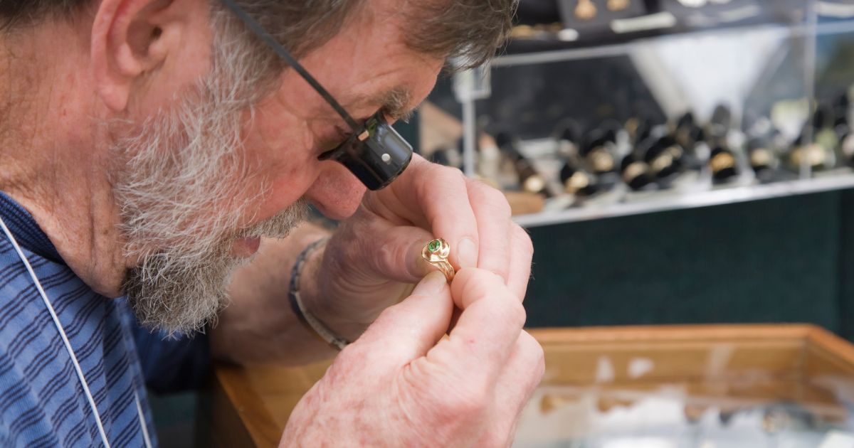 Jeweler appraising a ring